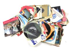 An assortment of 1960s 45 RPM 7" vinyl single records.