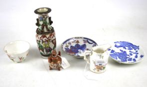 An assortment of ceramics. Comprising a satsuma tripod vase,