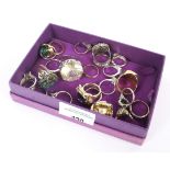 An assortment of 23 dress rings, mostly costume some set in silver and gold various design and ages.