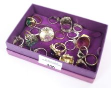 An assortment of 23 dress rings, mostly costume some set in silver and gold various design and ages.