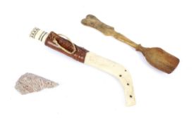 An assortment of 3 unusual collectables including a stone spearhead and a small hand carved spoon.
