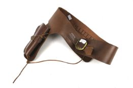 A replica cowboy's brown leather gun holster and bullet belt.