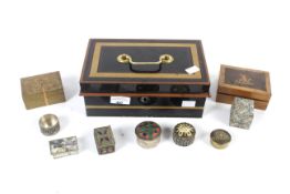 A vintage cash tin with an assortment of lidded boxes and pill boxes.