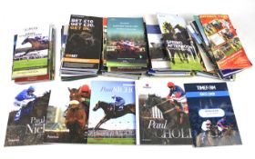 A box of assorted contemporary horse racing programmes.