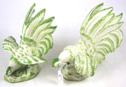 A pair of ceramic roosters.