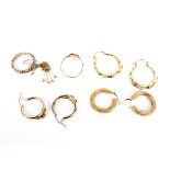 An assortment of three 9ct gold earrings and two 9ct gold rings etc 10.6 grams.