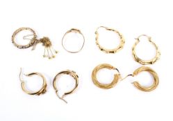 An assortment of three 9ct gold earrings and two 9ct gold rings etc 10.6 grams.