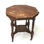 A 20th century wooden table of octagonal form.