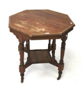 A 20th century wooden table of octagonal form.
