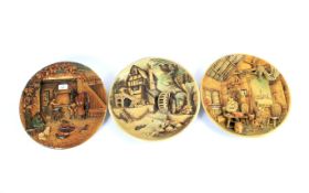 A set of 3 Bossons wall chargers depicting a water mill, nautical house and a blacksmiths work shop,