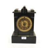 A Victorian black marble mantle chiming clock.