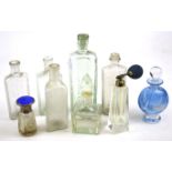 An assortment of 19th and 20th century glass bottles and four perfume bottles.