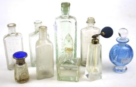 An assortment of 19th and 20th century glass bottles and four perfume bottles.