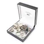 Twenty assorted silver and white metal rings,