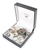 Twenty assorted silver and white metal rings,