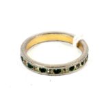 A decorative simulated emerald and diamond eternity ring, size L.