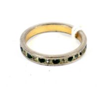 A decorative simulated emerald and diamond eternity ring, size L.