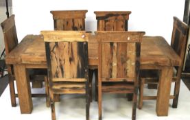 A rustic wooden table and set of six chairs.