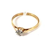 9ct gold and diamond solitaire ring with raised mount and open fret work decoration size P,