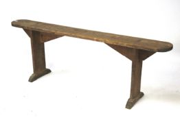 An early 20th century wooden bench.