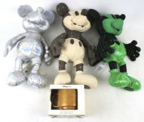 Three Disney Mickey Mouse soft toys and a boxed 'Memories Mug'.
