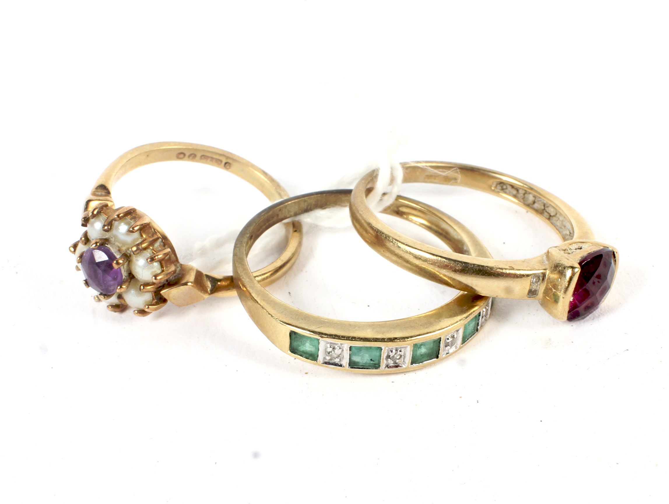 Three 9ct gold and gemstone rings.