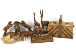 A collection of treen including a pair of bookends with carved dogs