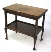 An Edwardian mahogany fold over card/tea table.