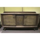 A heavy continental oak carved sideboard