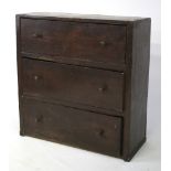 A wooden country chest of drawers. Three