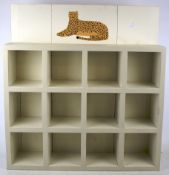 A set of wall display shelves. Containin