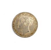 An 1872 shilling coin