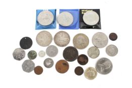 A small group of coins including three 1935 crowns.