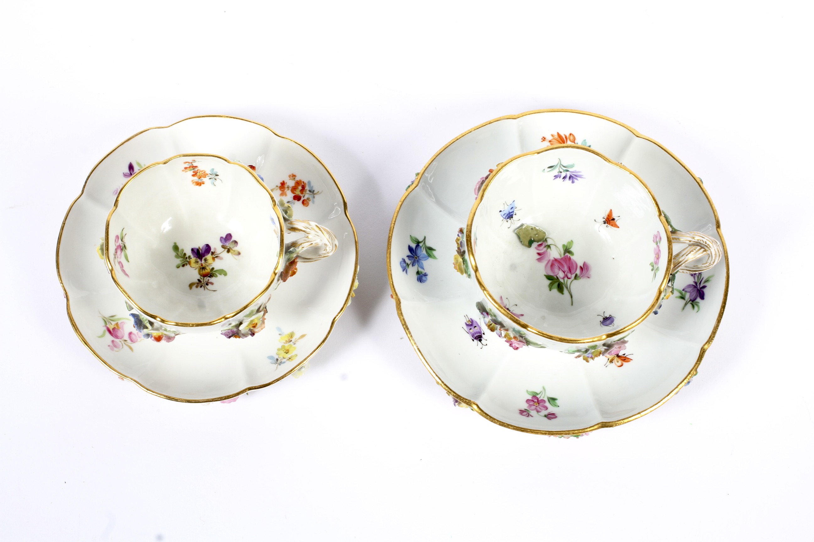 Two late 19th century Meissen flower encrusted teacups and saucers. - Image 2 of 3