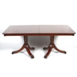 A Victorian style mahogany twin pedestal dining table.