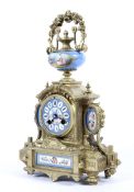 A gilt-metal and Sevres-style porcelain mounted mantel clock, circa 1900.