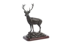 A bronze model of a stag.