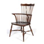 A 20th century comb back Windsor chair.