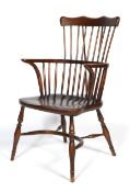 A 20th century comb back Windsor chair.