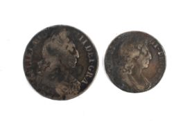 A 1696 crown coin and a 1697 half crown coin.