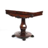 A Victorian rosewood card table.