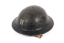 A WWII British Home Front Air Raid Wardens helmet.