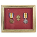 A WWI pair of medals and a cap badge. For Sgt Pte Foreman.