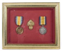 A WWI pair of medals and a cap badge. For Sgt Pte Foreman.