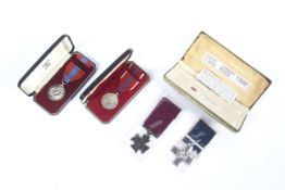 Two Queen Elizabeth II awards and two replica gallantry medals