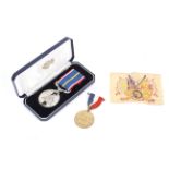 A boxed National Service Medal and an Edward VIII Coronation Medal