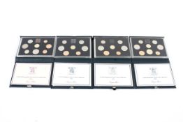 Four proof coin sets from 1983, 1985,