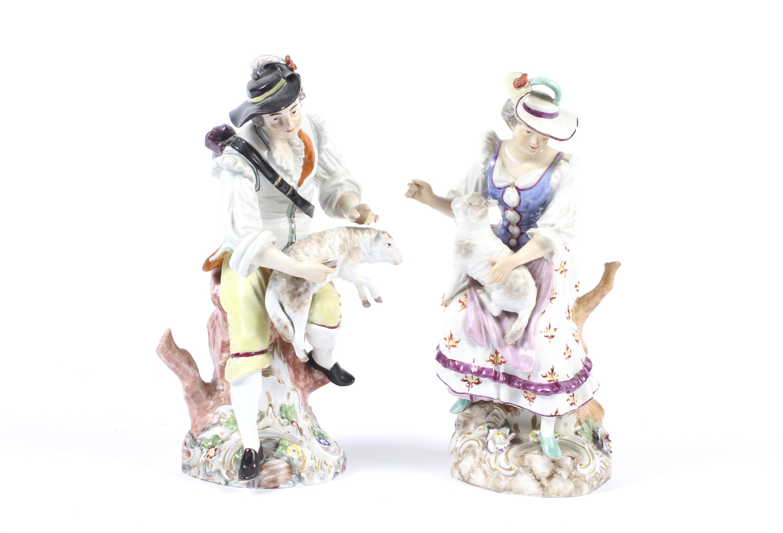 A pair of late 19th century German porcelain Meissen-style figures of a shepherd and shepherdess.