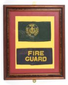 A framed and glazed WWII Fire Guards arm band and a Boy Scouts War Service Scouts arm band.