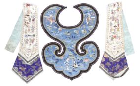 An early 20th century Chinese embroidered blue silk collar and a pair of lapel hangings.
